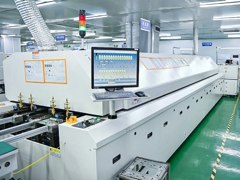 Inline convection reflow oven used for soldering PCB assemblies in SMT production