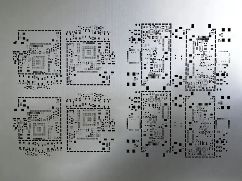 Laser-cut SMT stencil with repeated aperture patterns for a panelized PCB layout