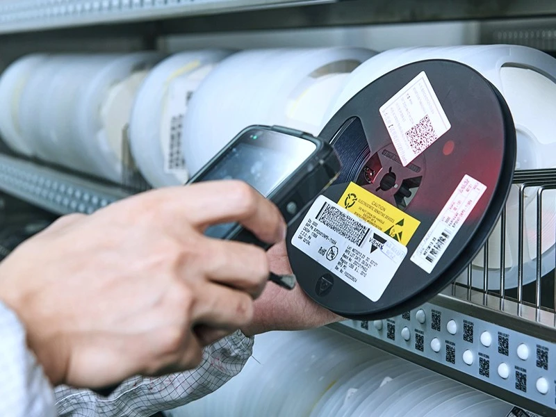 Supplier-Side Identification and Traceability Records Barcode scanning of a labeled electronic component reel for material traceability