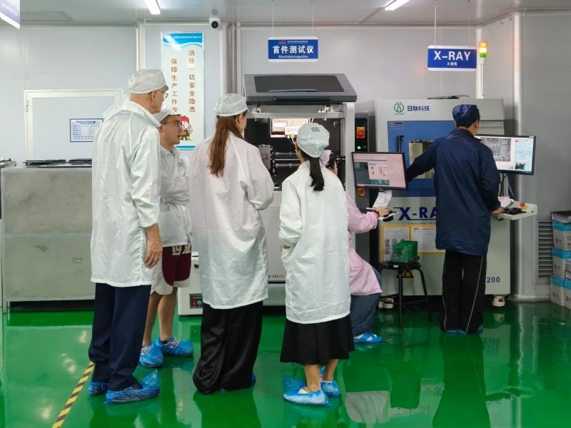 STHL First-Article Inspection and X-ray Testing Area Visitors reviewing first-article inspection and X-ray inspection equipment at STHL